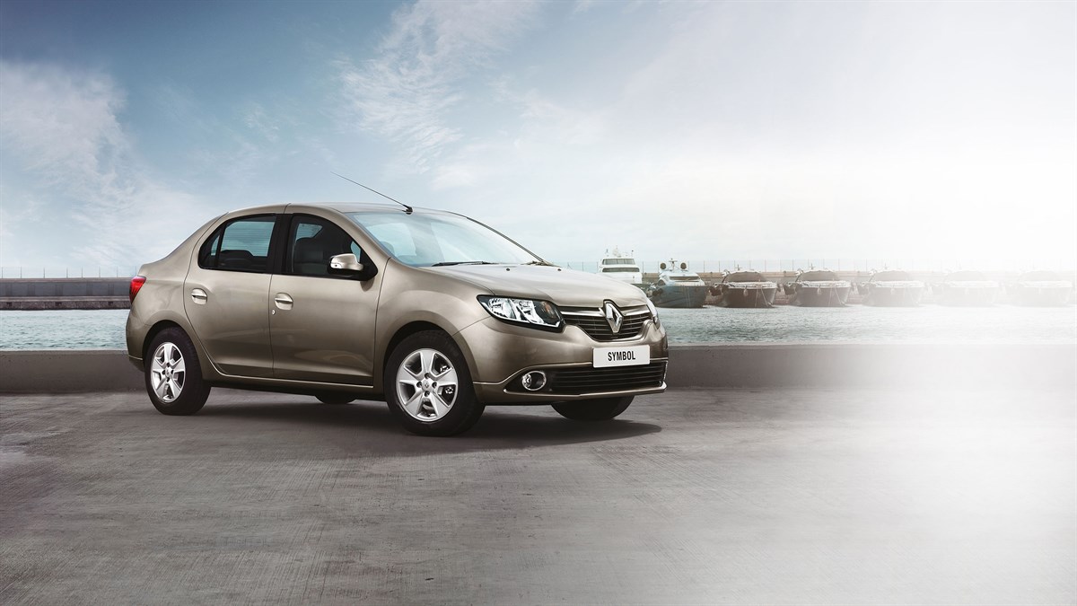 A man driving a Renault SYMBOL
